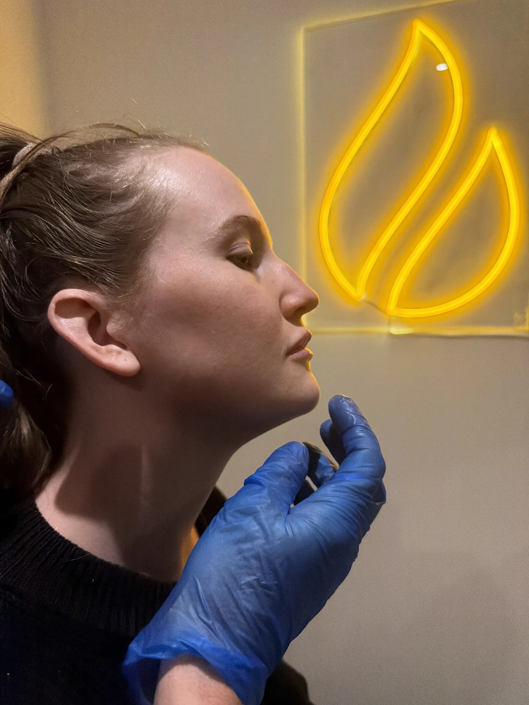 Staff model during jawline and side profile assessment