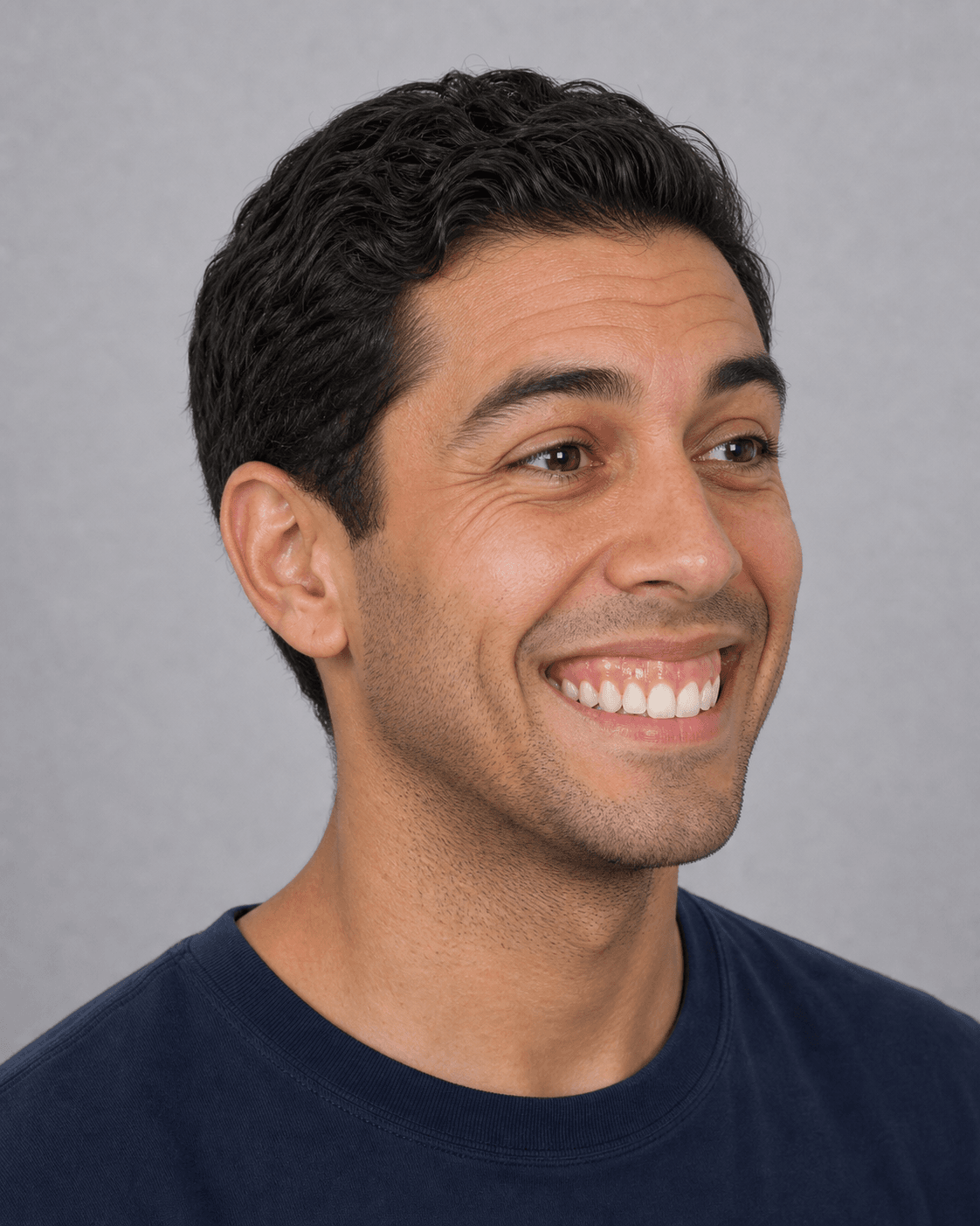 Three-quarter portrait of an adult man showing natural upper-lip visibility and lower-face proportion