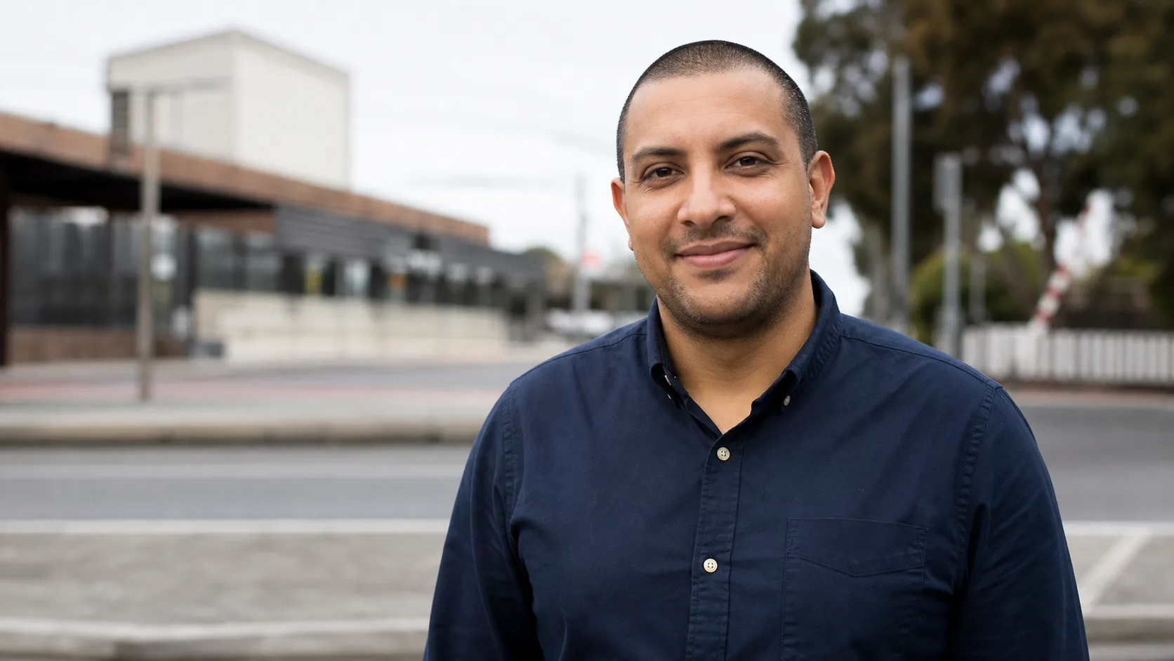 Smiling man standing on a suburban street in Murrumbeena