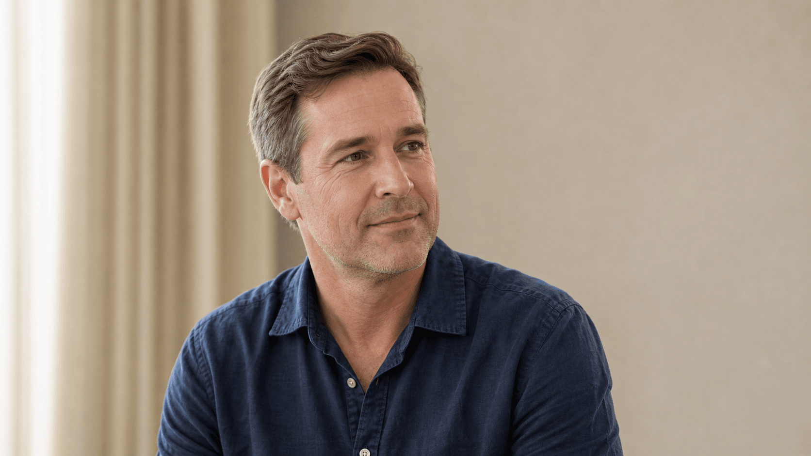 Adult patient in an under-eye assessment conversation at Core Aesthetics