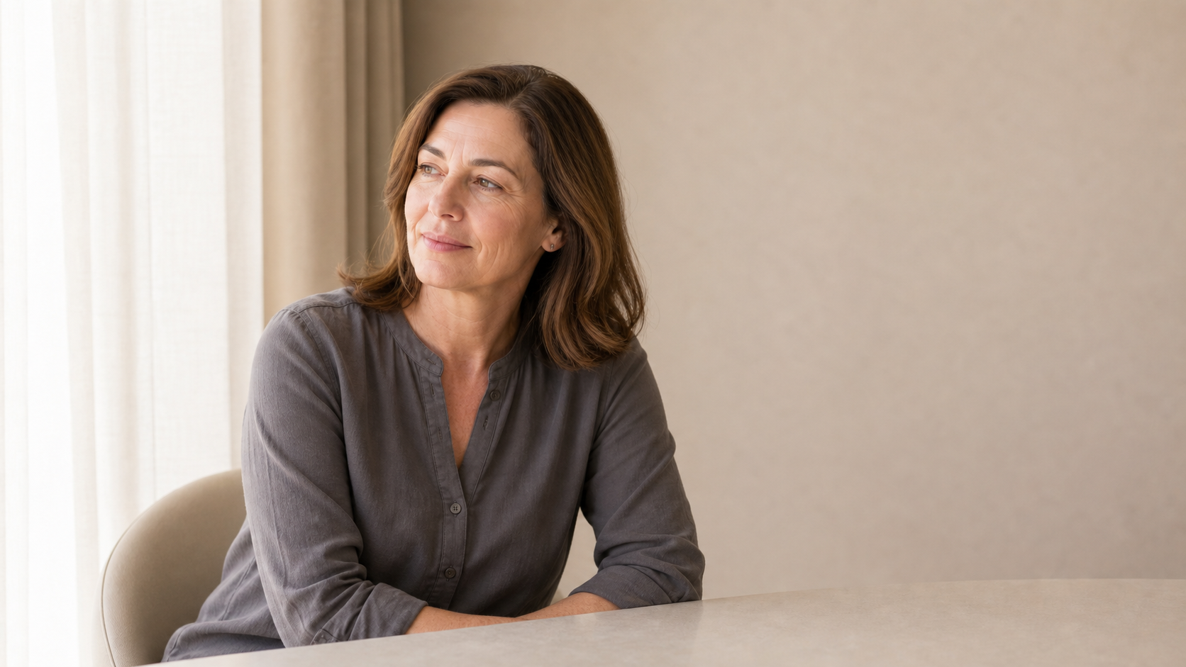 Adult patient speaking with a practitioner during a private aesthetic consultation