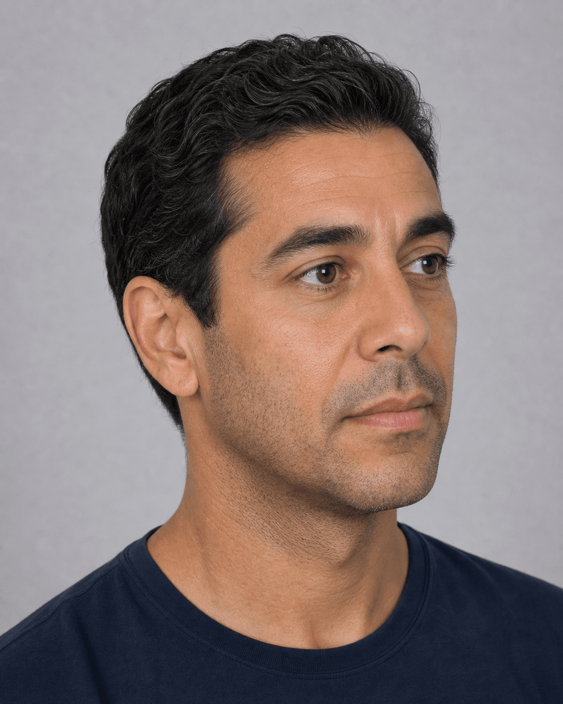 Three quarter portrait of an adult man showing natural lip and lower face proportion