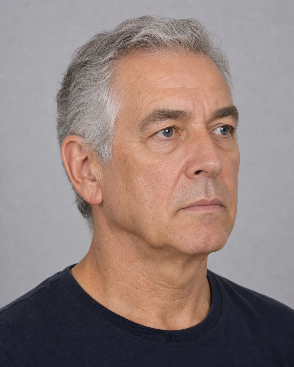 Adult man in three-quarter profile for a jawline and lower-face assessment discussion