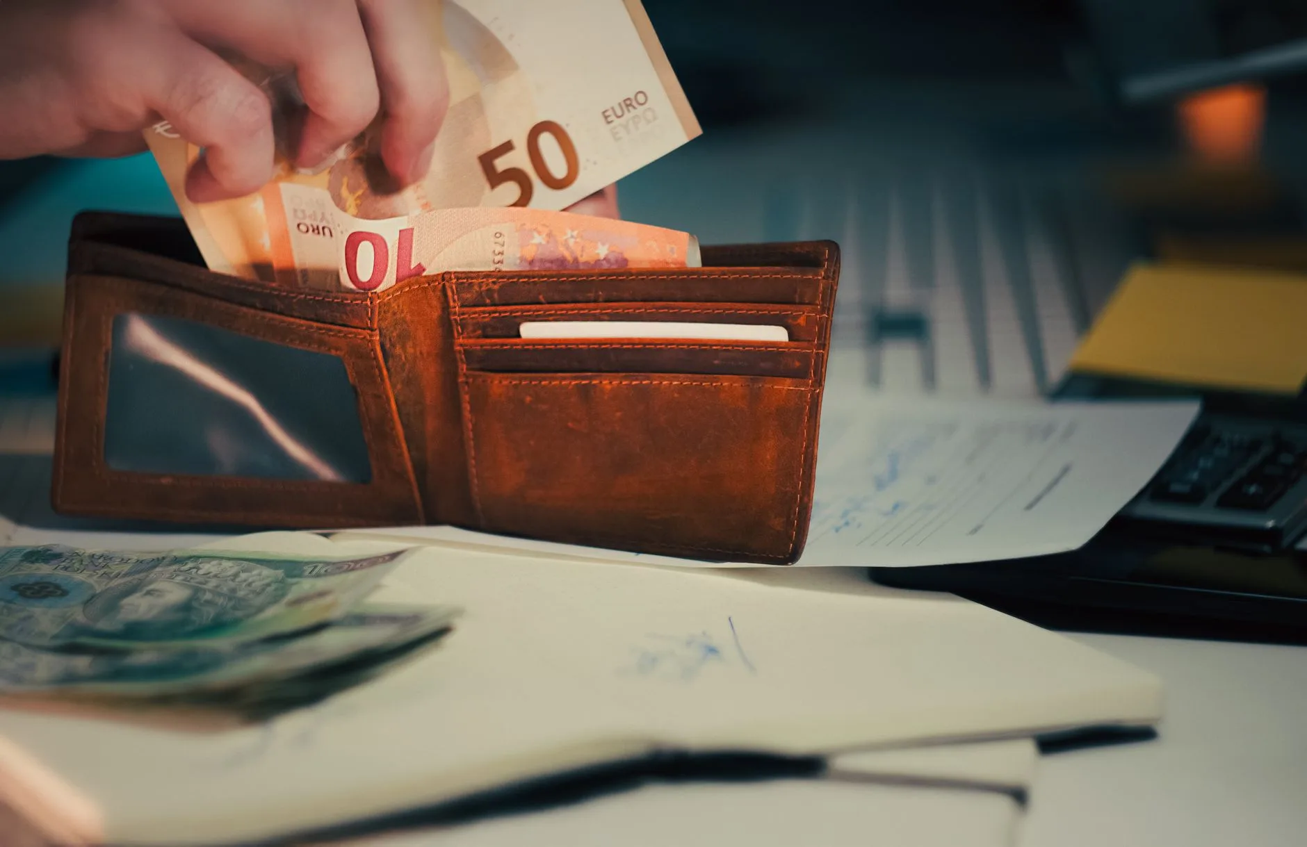 Wallet and banknotes, illustrating the cost of healthcare.