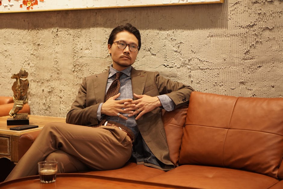 Well-presented adult in a calm modern interior supporting a refined aesthetics discussion.