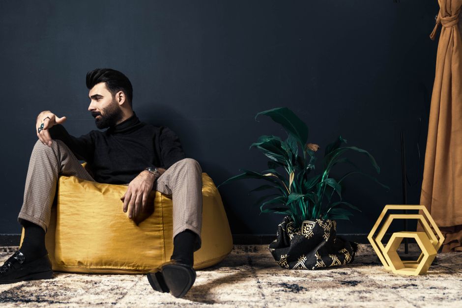 Well-presented adult in a calm modern interior supporting a refined aesthetics discussion.