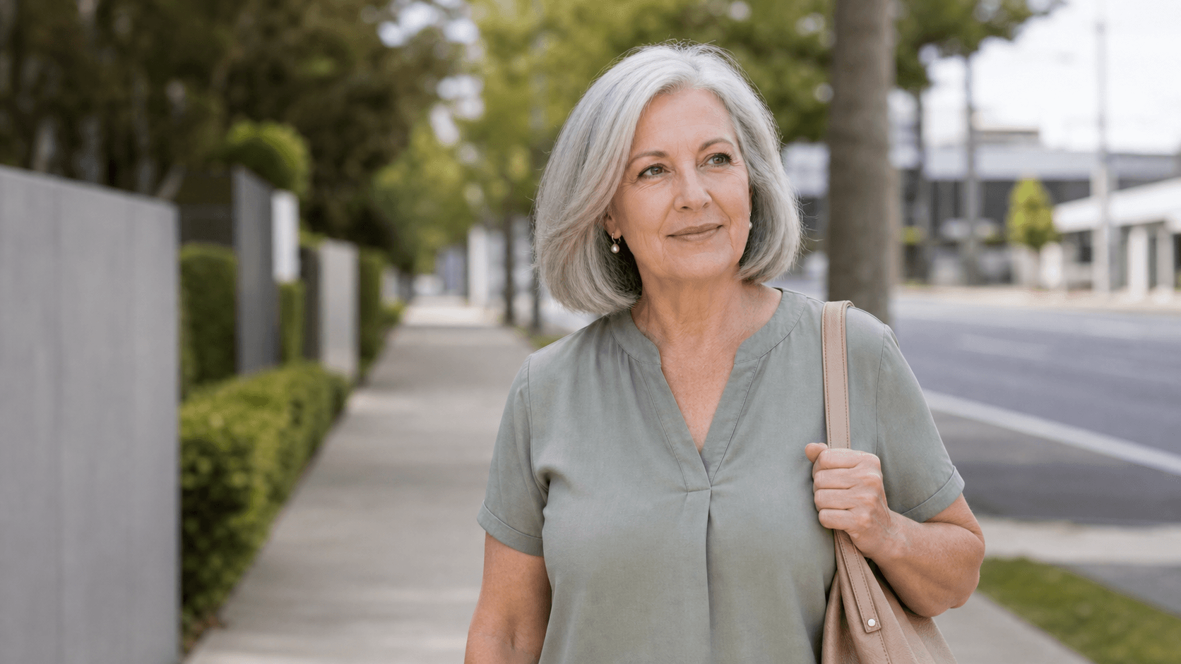 Illustrative older adult walking outdoors while returning to an ordinary daily routine