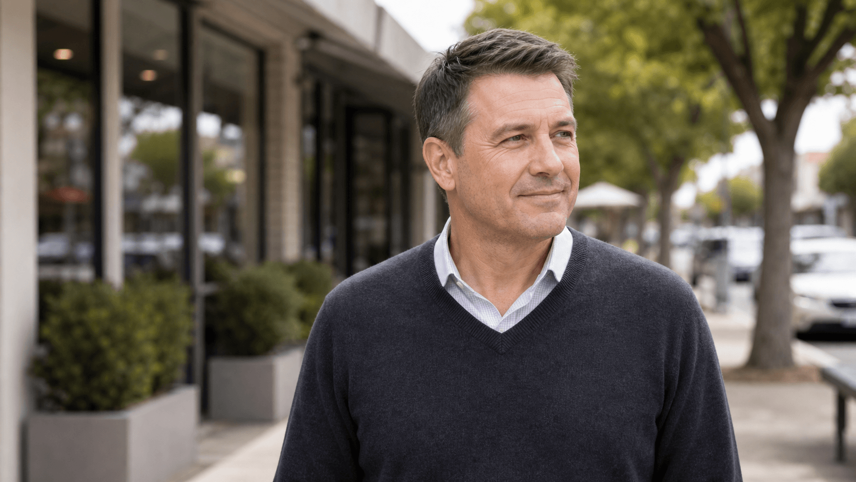 Corey Anderson RN listening to an adult patient during an aesthetic consultation in Oakleigh