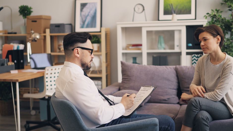 Private consultation discussion with notes in a calm modern setting.