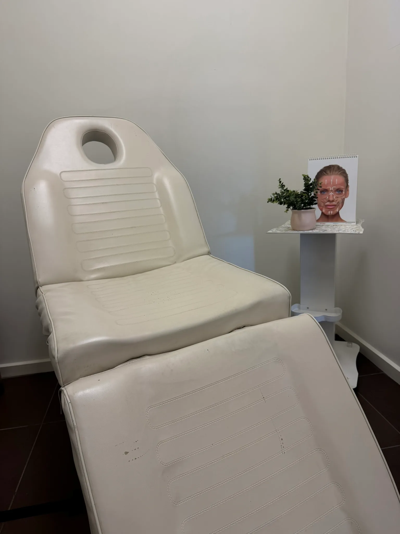 Empty consultation chair and side table inside the genuine Core Aesthetics Oakleigh clinic